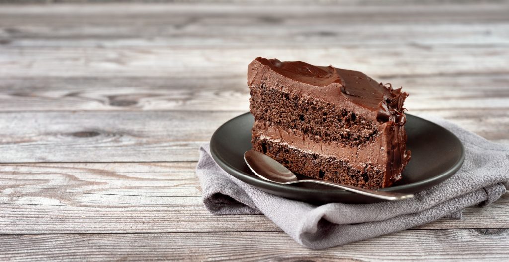 Slice of chocolate cake on a place