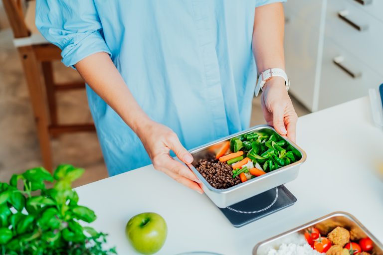 Working Parents meal prepping a dish for later in the week