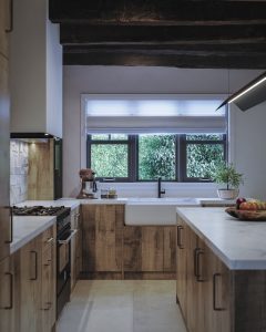 A country cottage style kitchen from The Kitchen Depot using the Walnut Chalet Oak decor.
